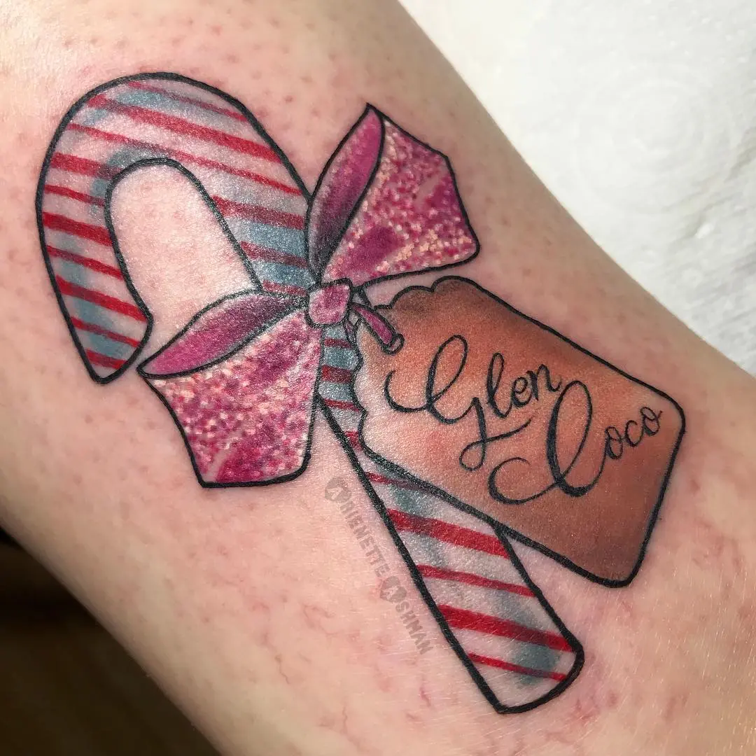 Festive candy cane tattoo with a playful twist