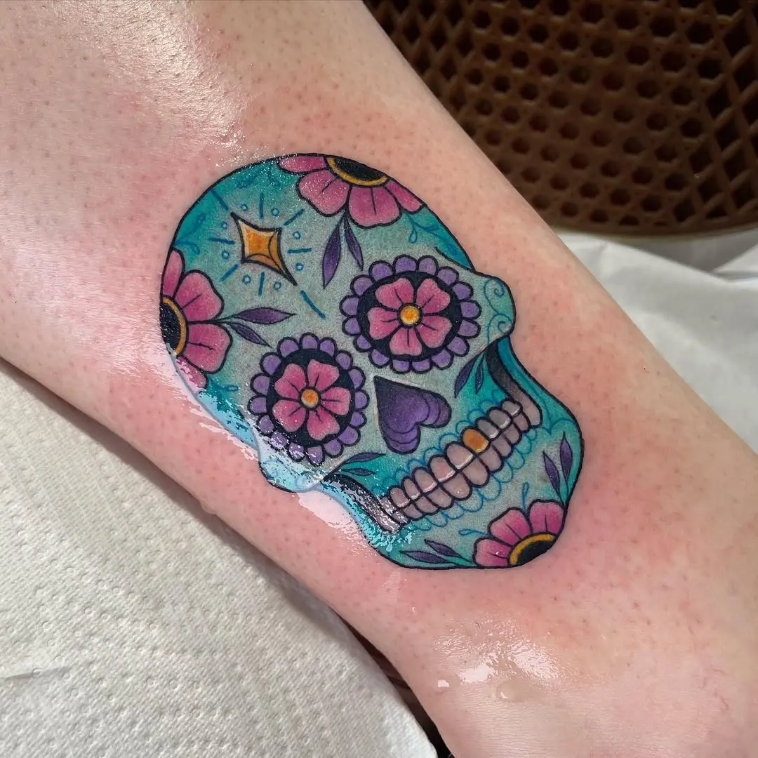 Vibrant sugar skull adorned with floral motifs