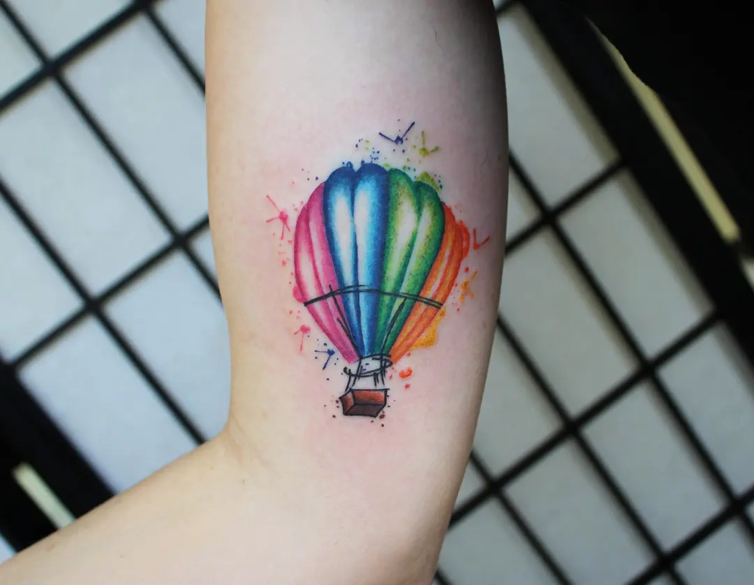 Vibrant hot air balloon tattoo with colorful vibes