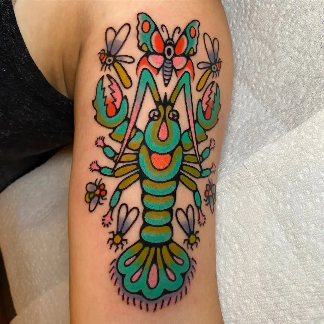 Colorful lobster tattoo with whimsical insects design