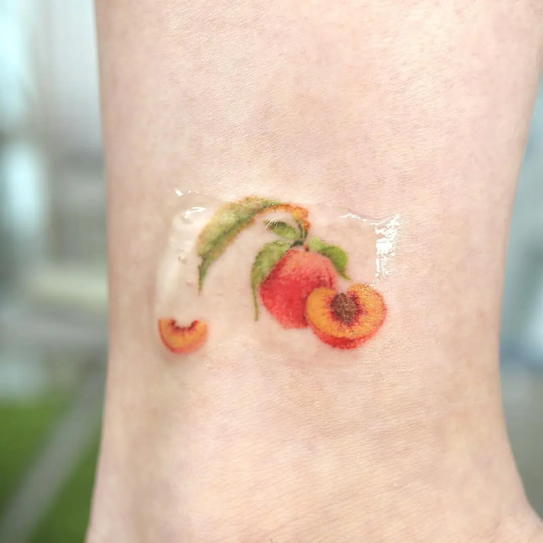 Vibrant Peach Tattoo on Ankle
