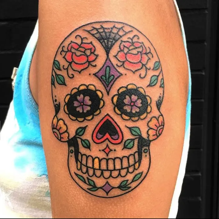 Vibrant Sugar Skull Tattoo with Floral Elements