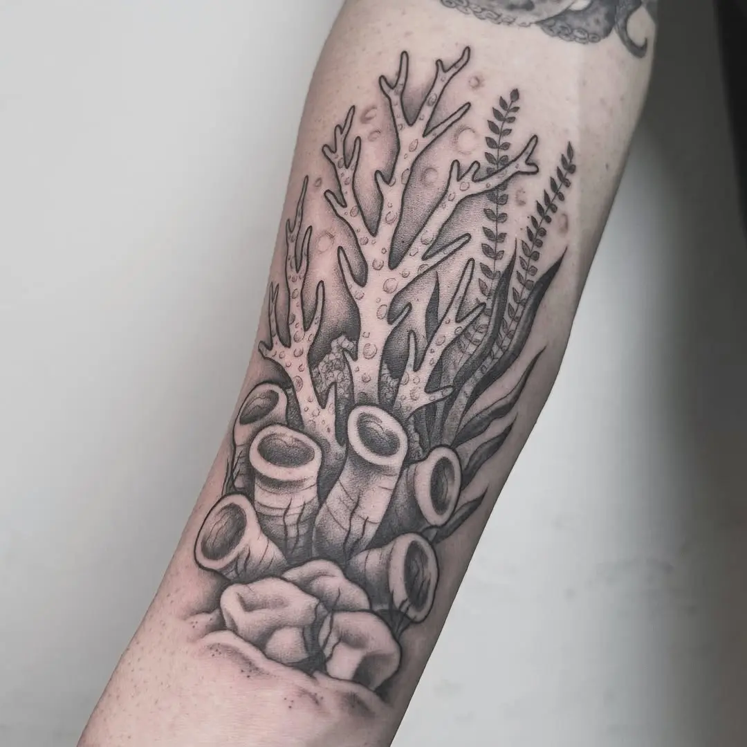 Intricate black and gray coral reef tattoo design