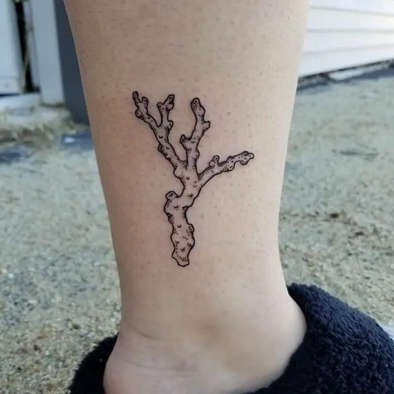Minimalist coral reef tattoo on ankle