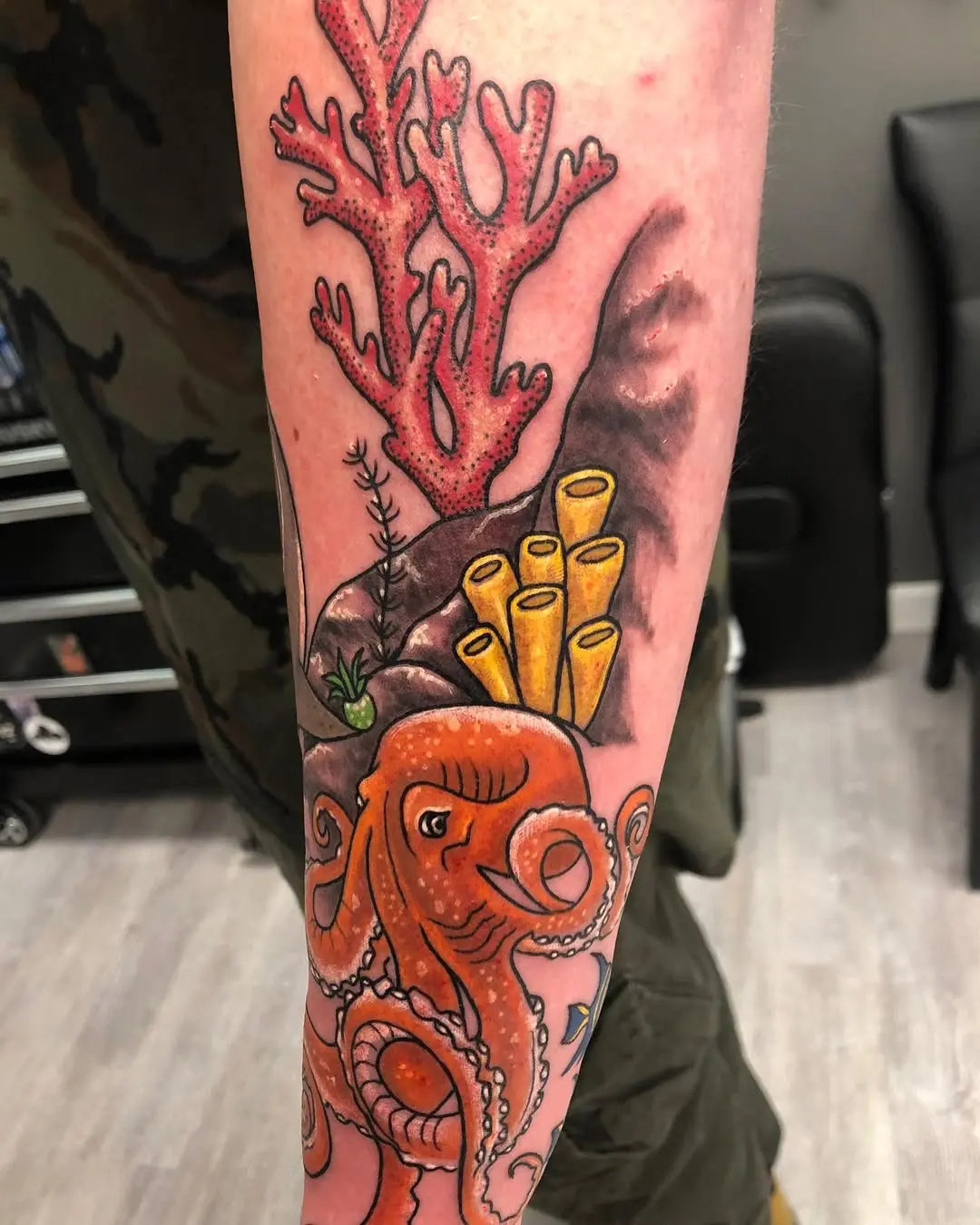 Vibrant Coral Reef Tattoo Featuring an Octopus