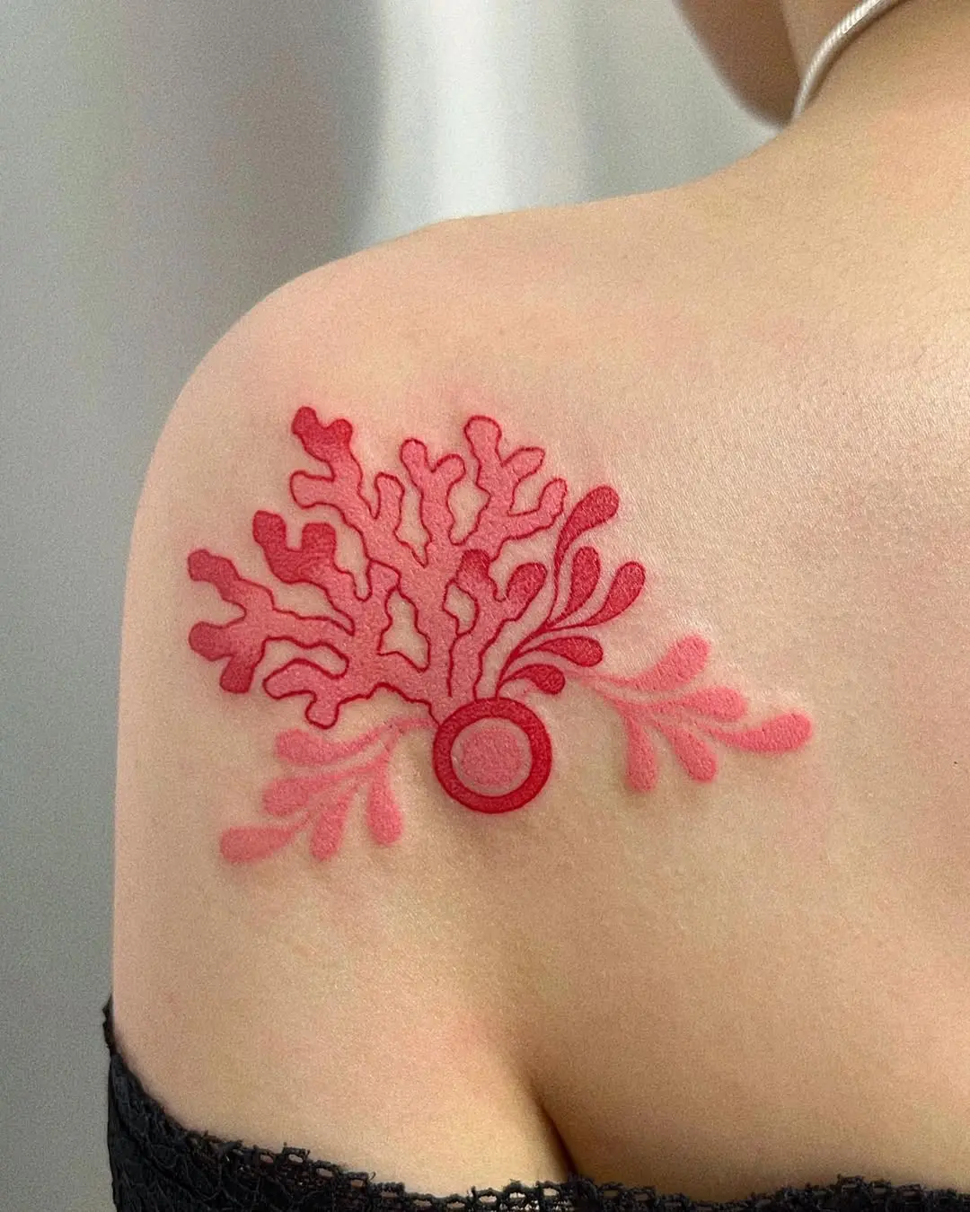 Vibrant Red Coral Tattoo on Shoulder