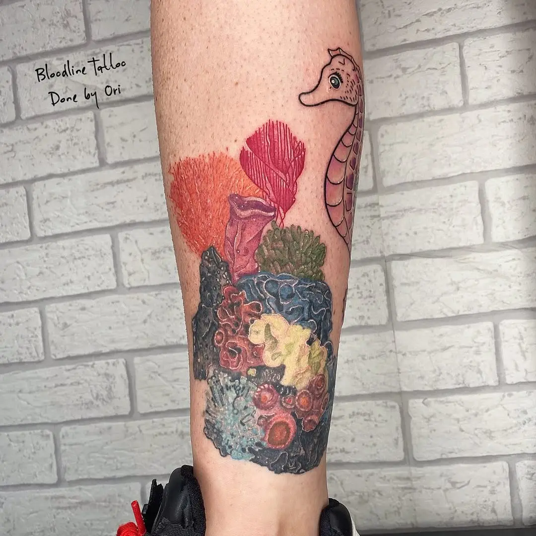 Vibrant seahorse and coral reef tattoo design