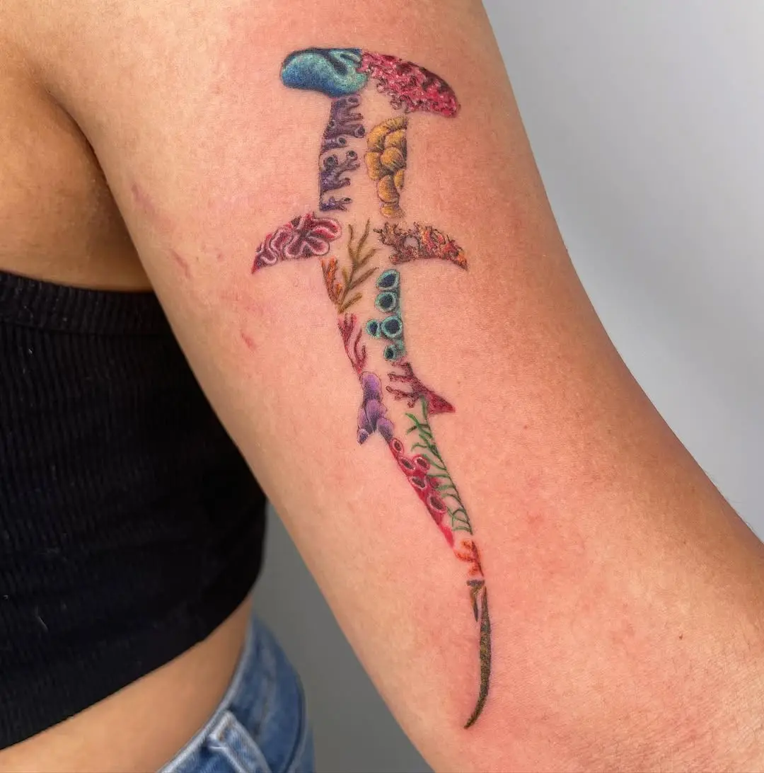 Vibrant shark tattoo with coral details