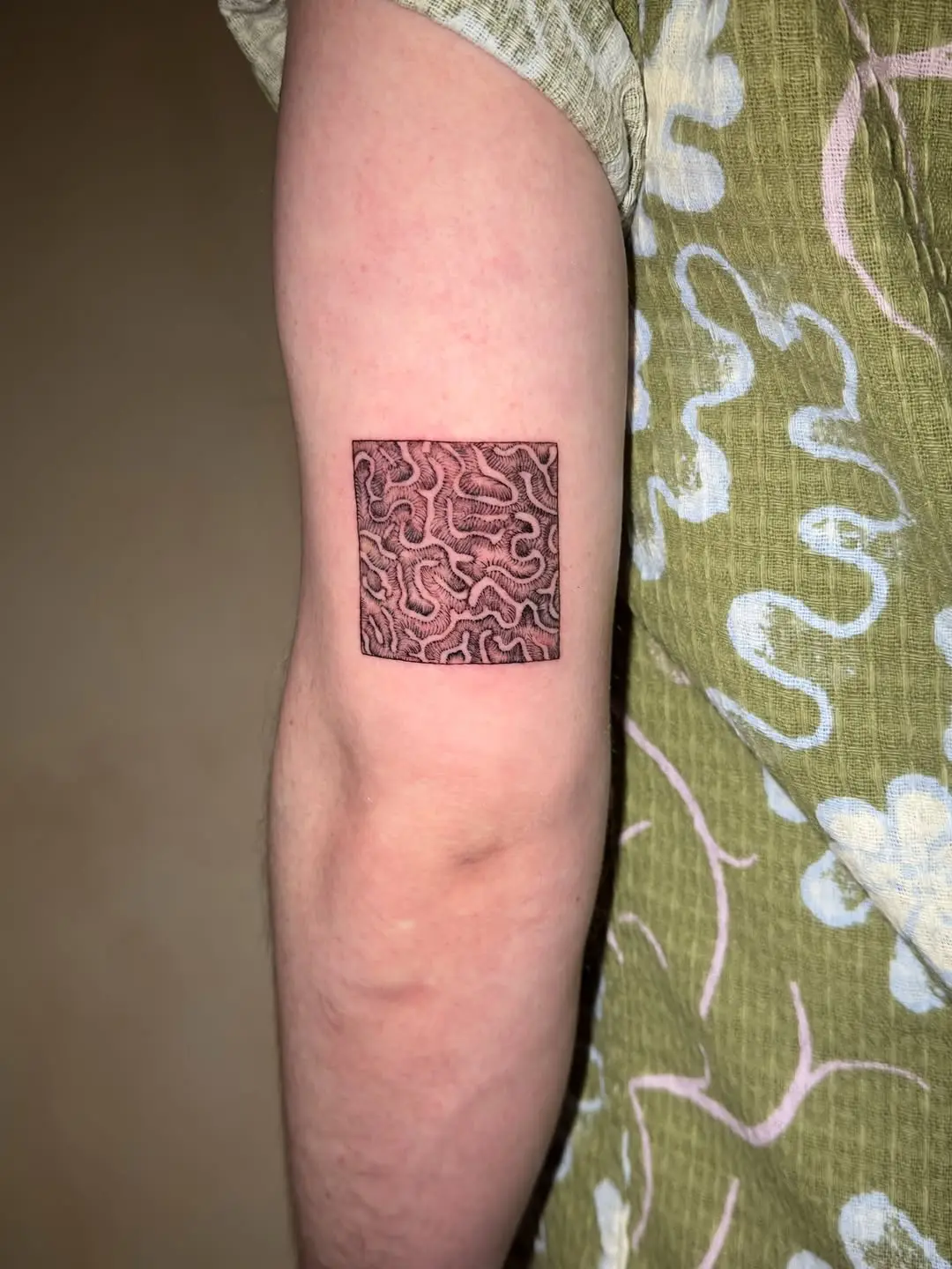 Intricate coral pattern tattoo on the arm