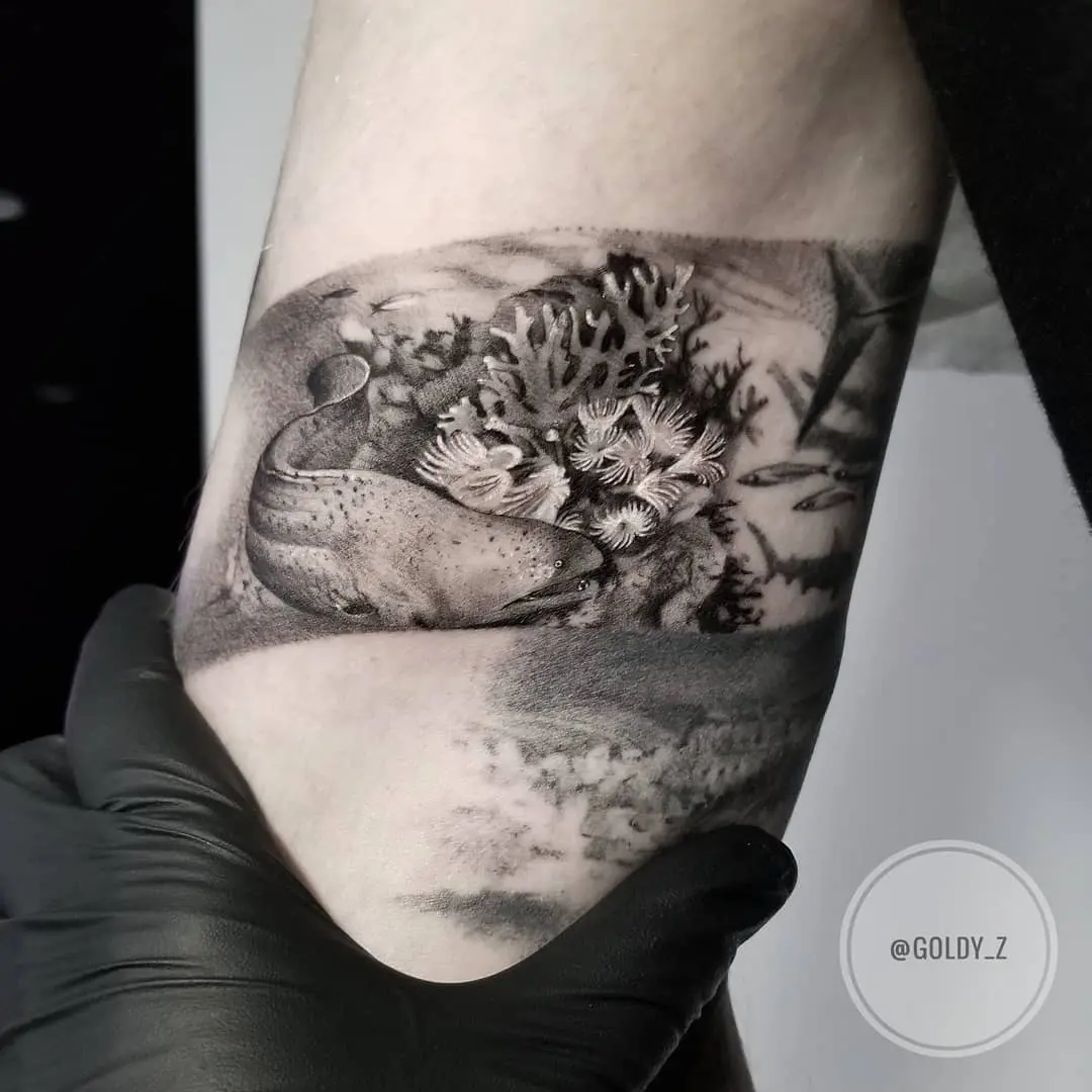 Intricate coral reef tattoo showcasing marine life