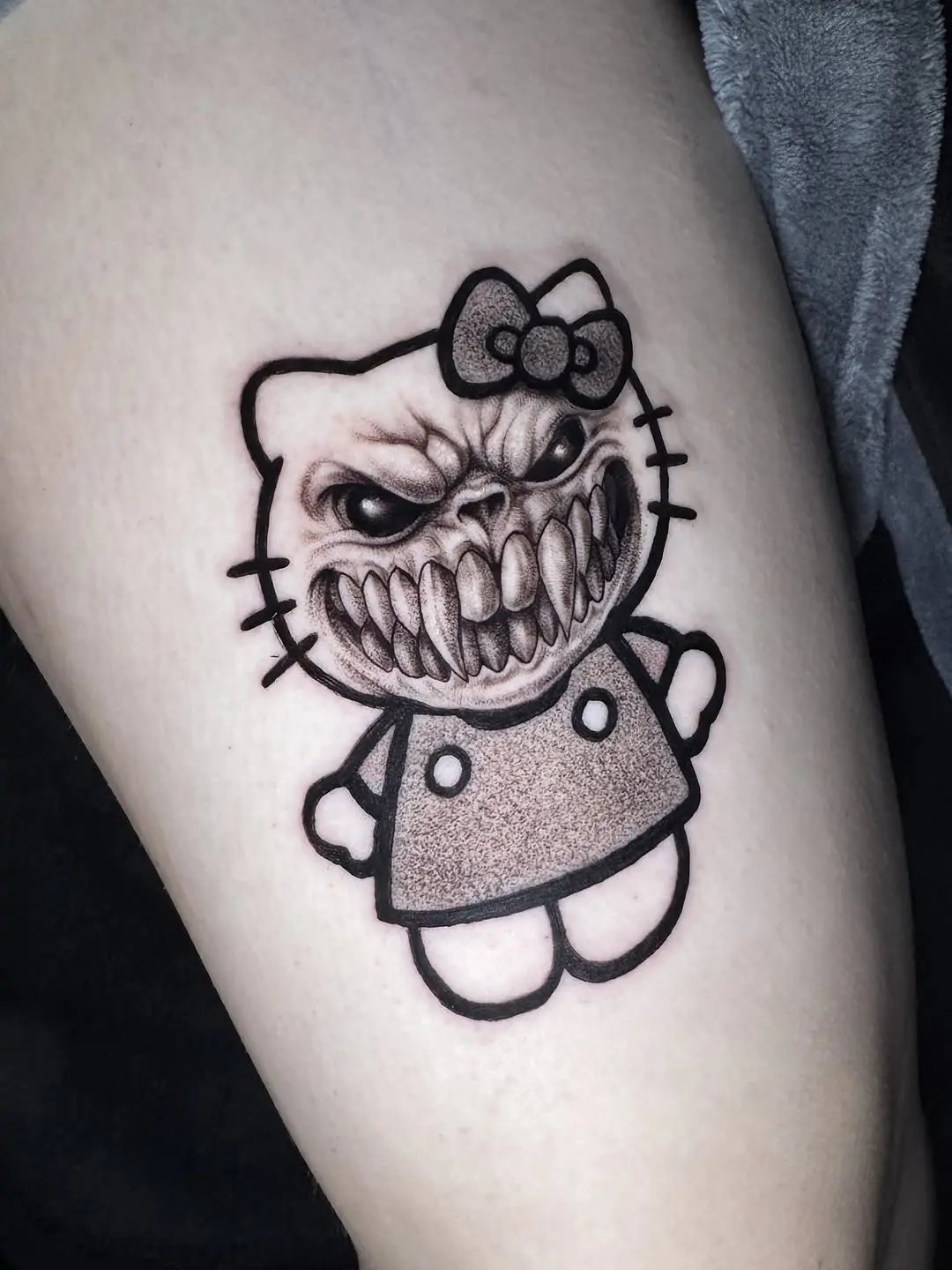 Unique twisted version of Hello Kitty tattoo