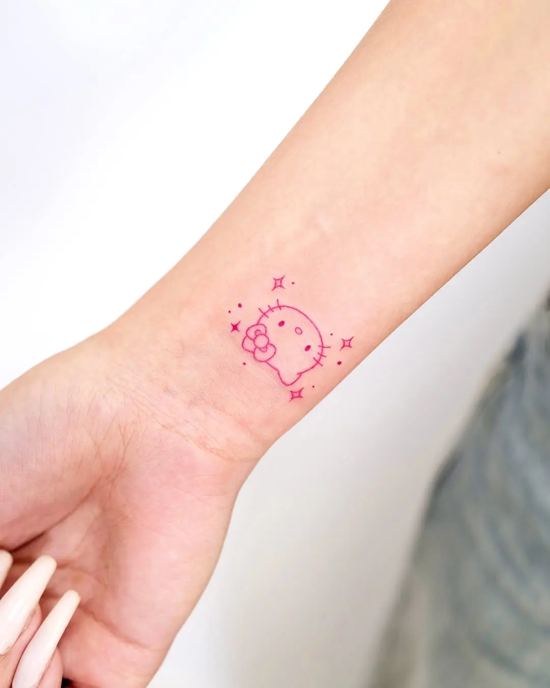 Charming pink skull tattoo with cute details