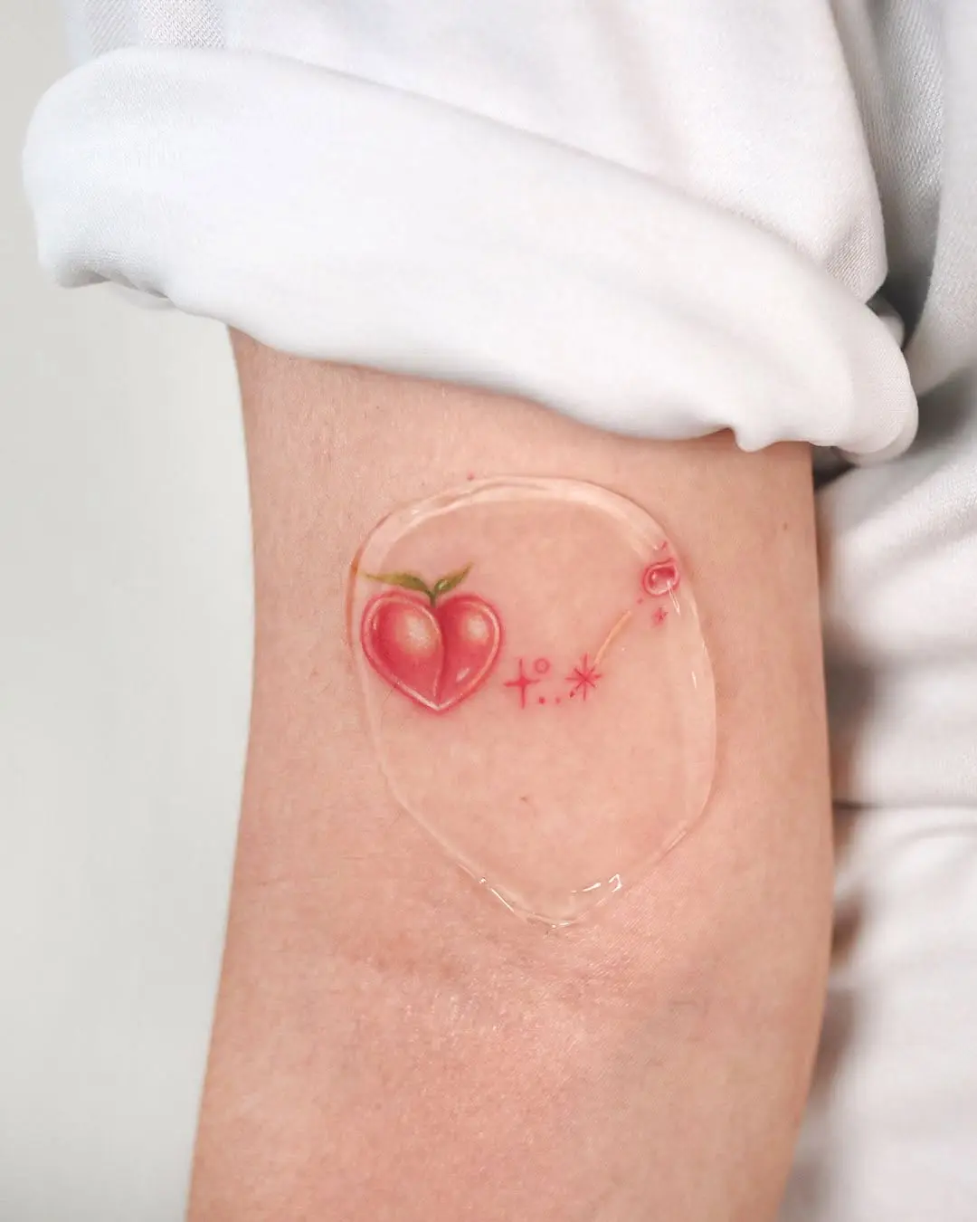 Charming peach tattoo with whimsical elements