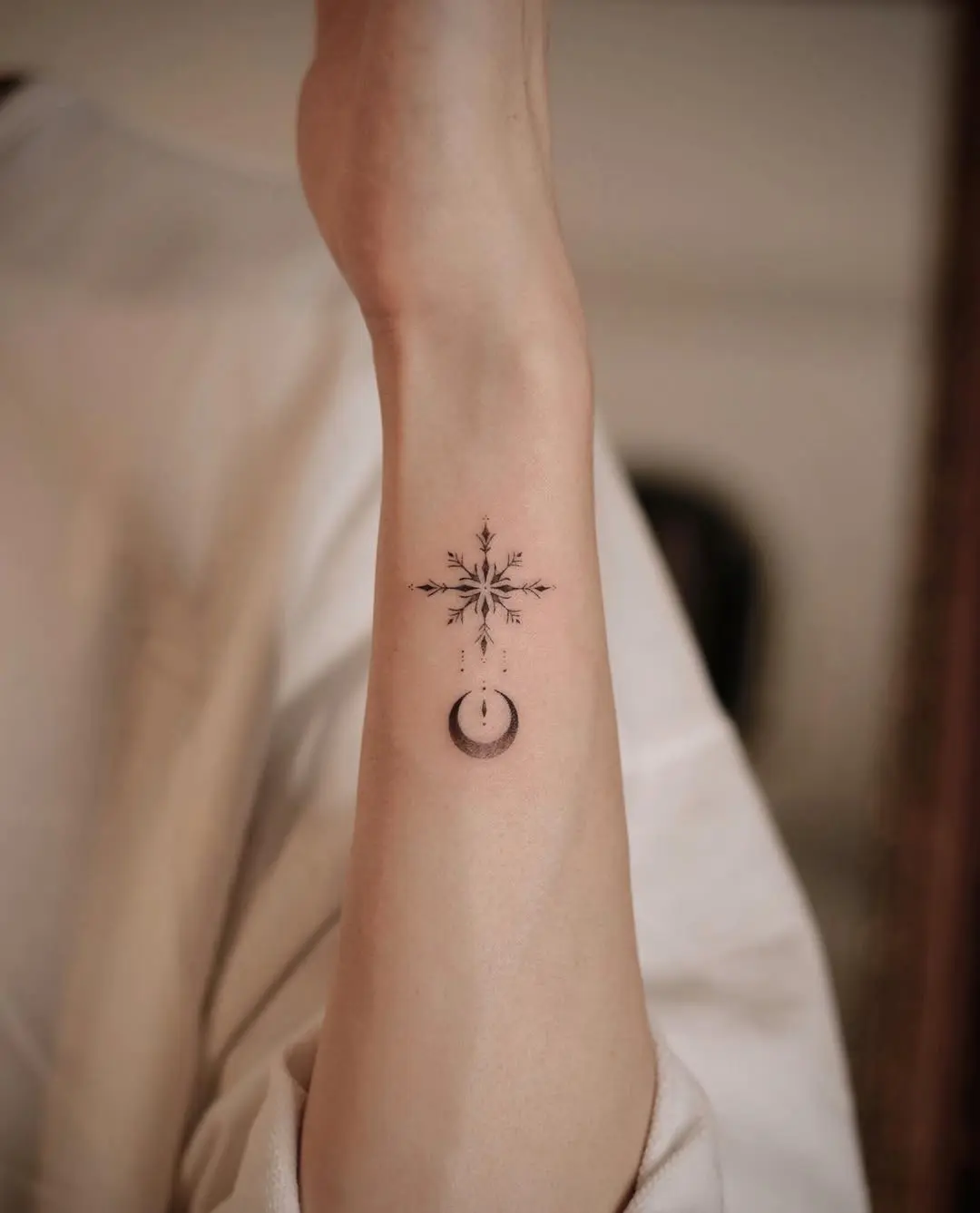 Elegant snowflake design with crescent moon