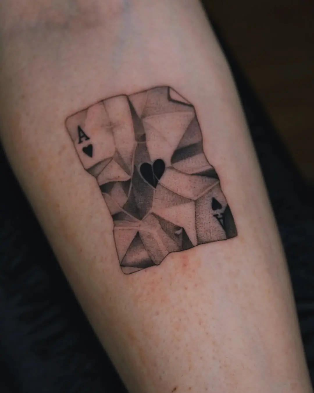 Intricate dotwork playing card tattoo design