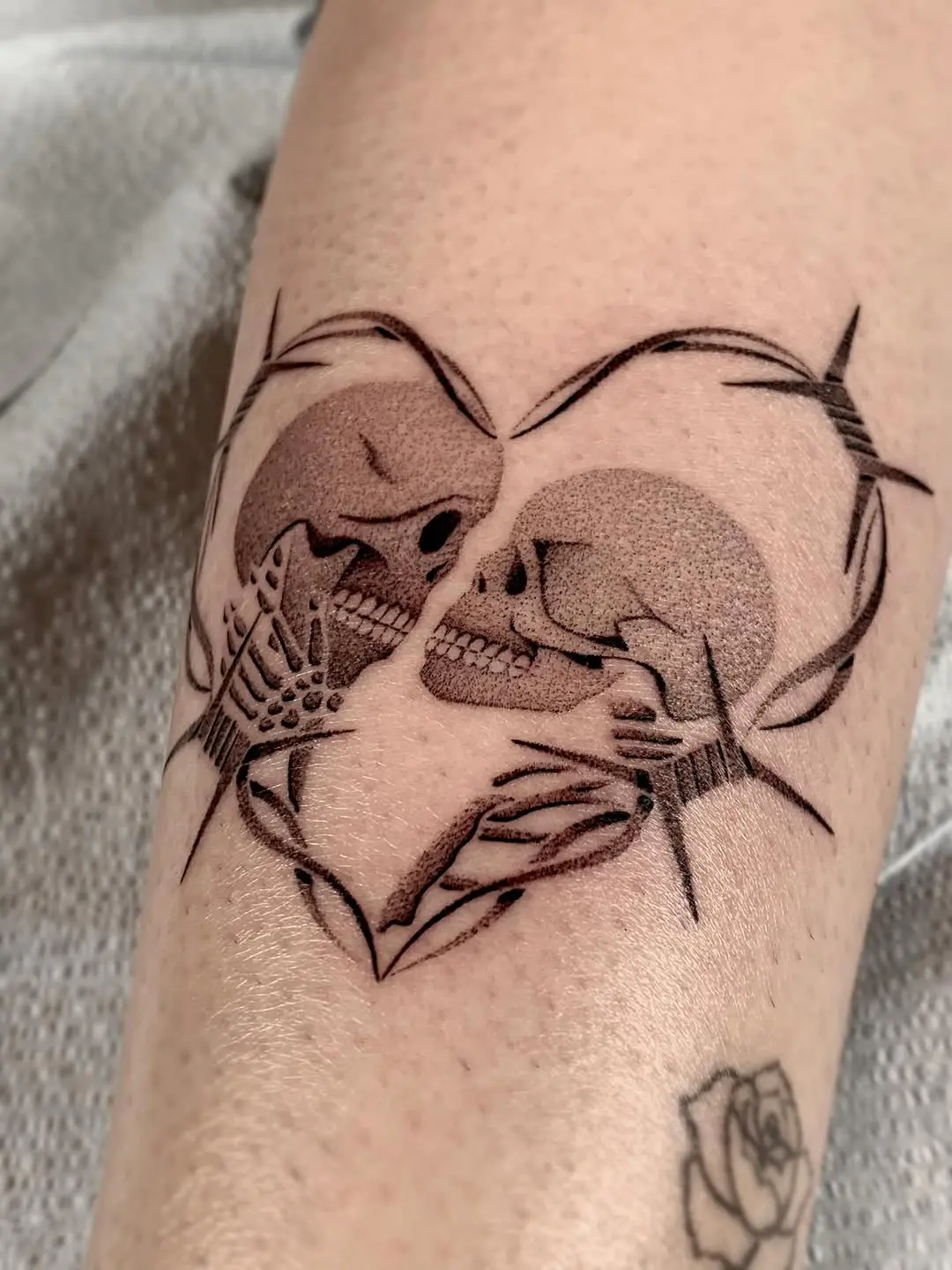 Intricate dotwork skull tattoo design with romance
