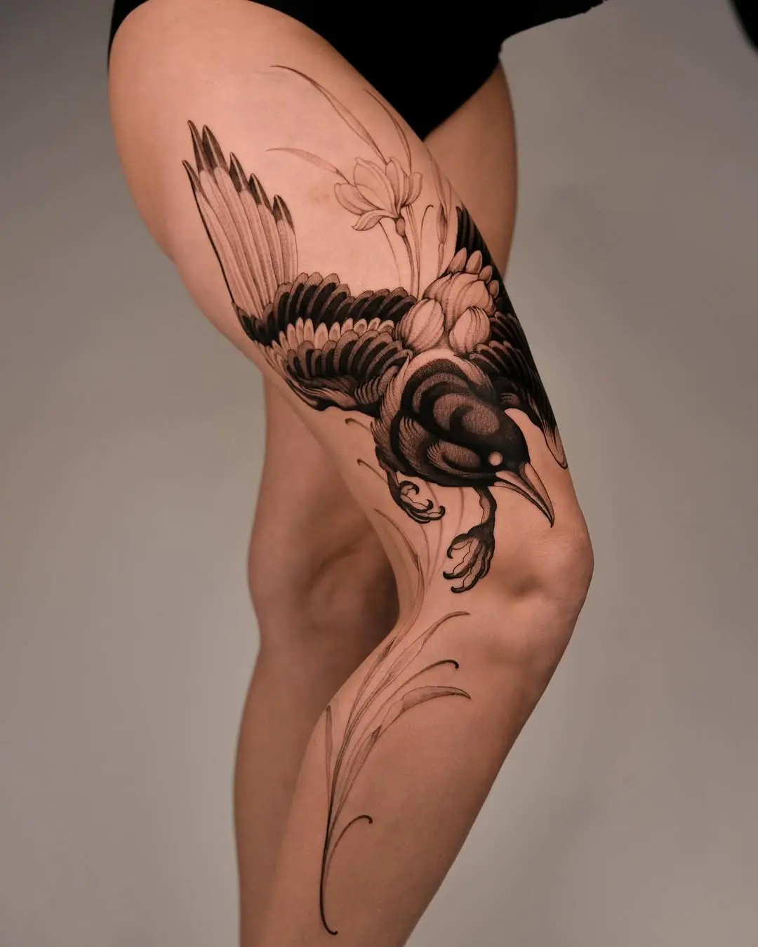 Elegant dotwork bird tattoo on thigh