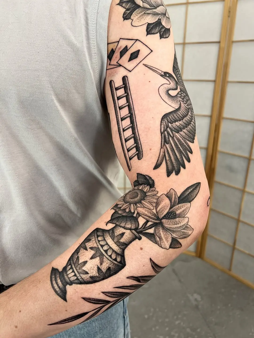 Intricate dotwork tattoo featuring nature elements