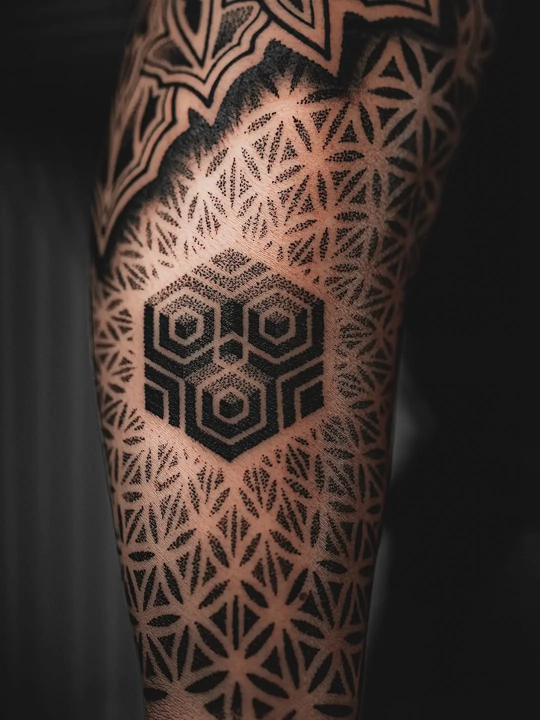 Intricate geometric dotwork tattoo design