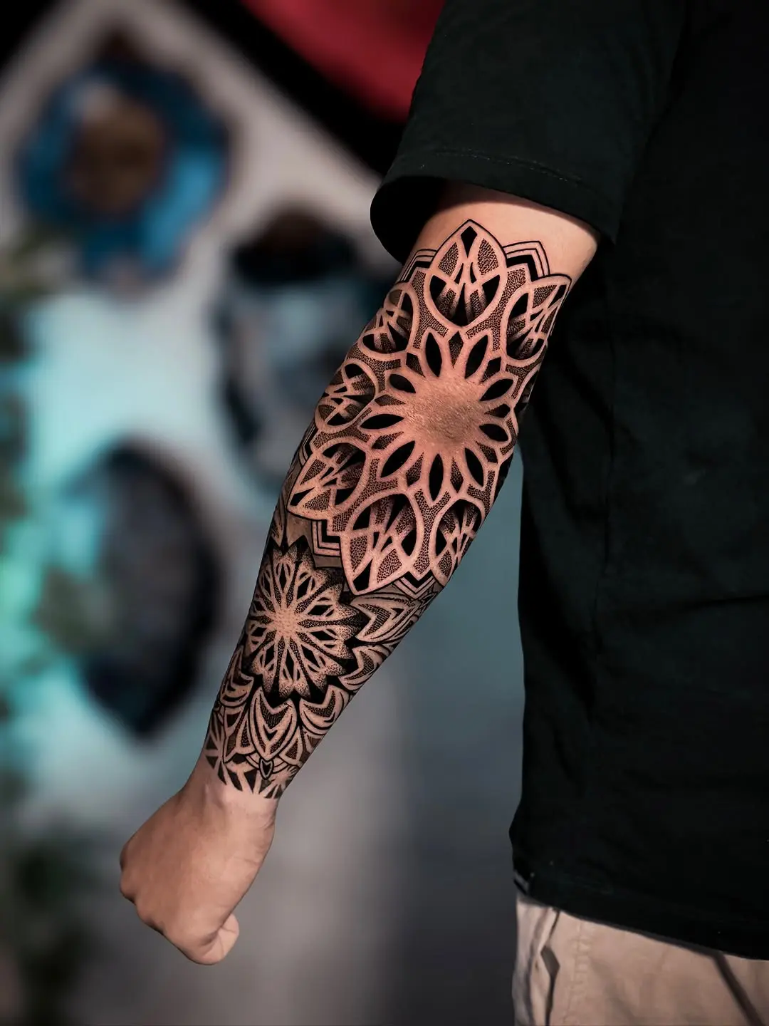 Intricate dotwork flower design on forearm