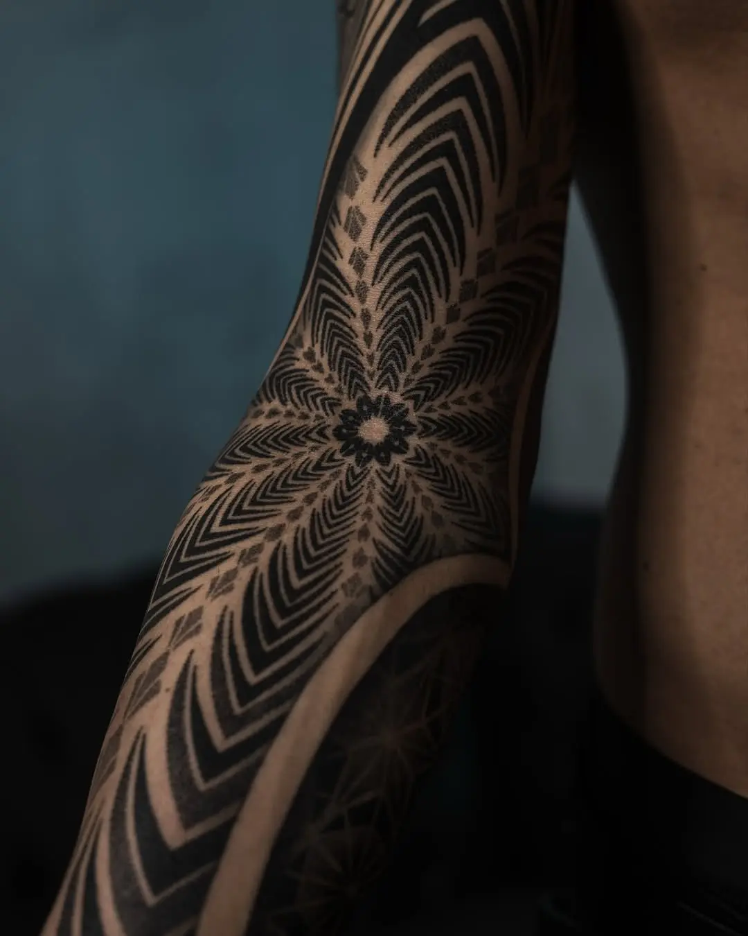 Intricate Dotwork Tattoo Featuring Geometric Shapes