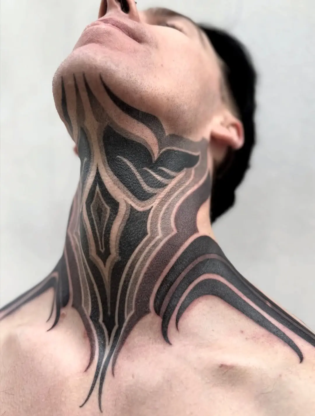 Intricate dotwork neck tattoo design