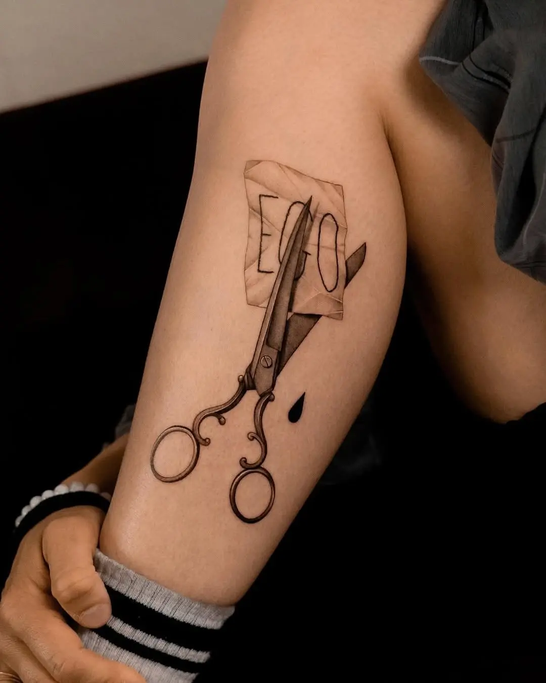 Intricate dotwork scissors tattoo on arm