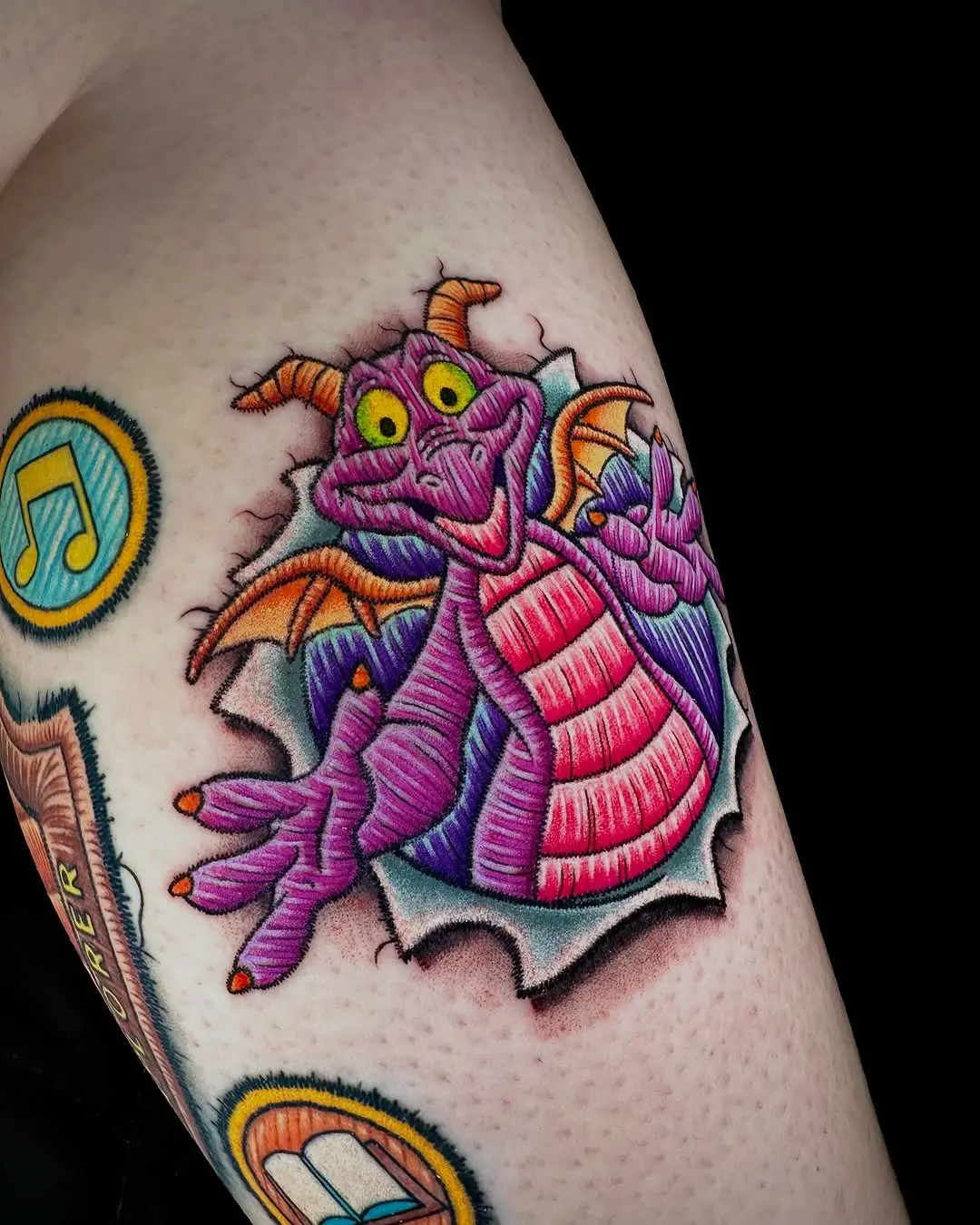 Vibrant embroidery dragon tattoo with playful vibes