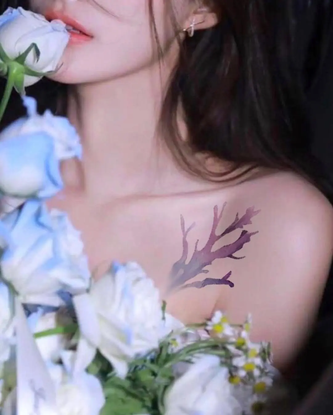 Delicate coral reef tattoo accented by roses
