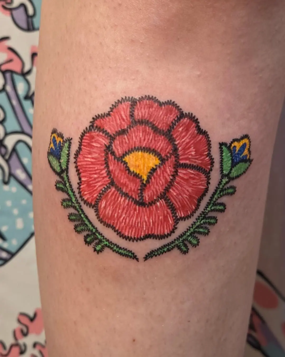 Vibrant floral embroidery tattoo design