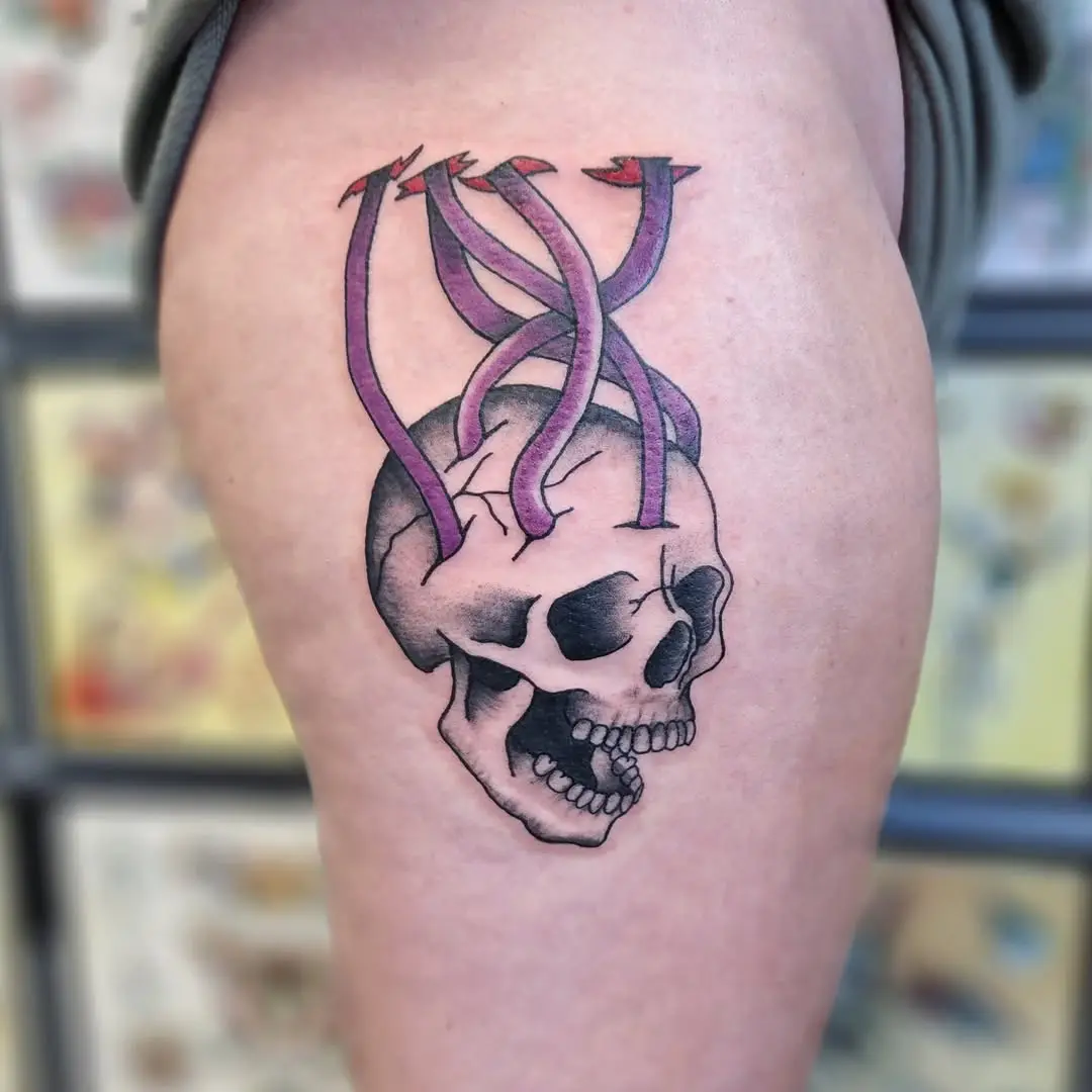 Bold skull with snake motifs in tattoo art