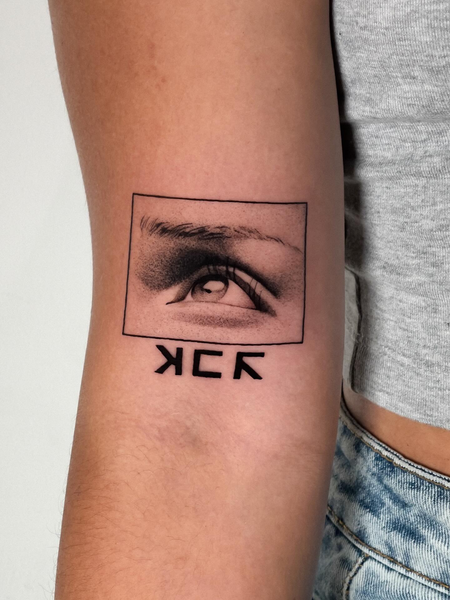 Intriguing eye tattoo blending art styles elegantly