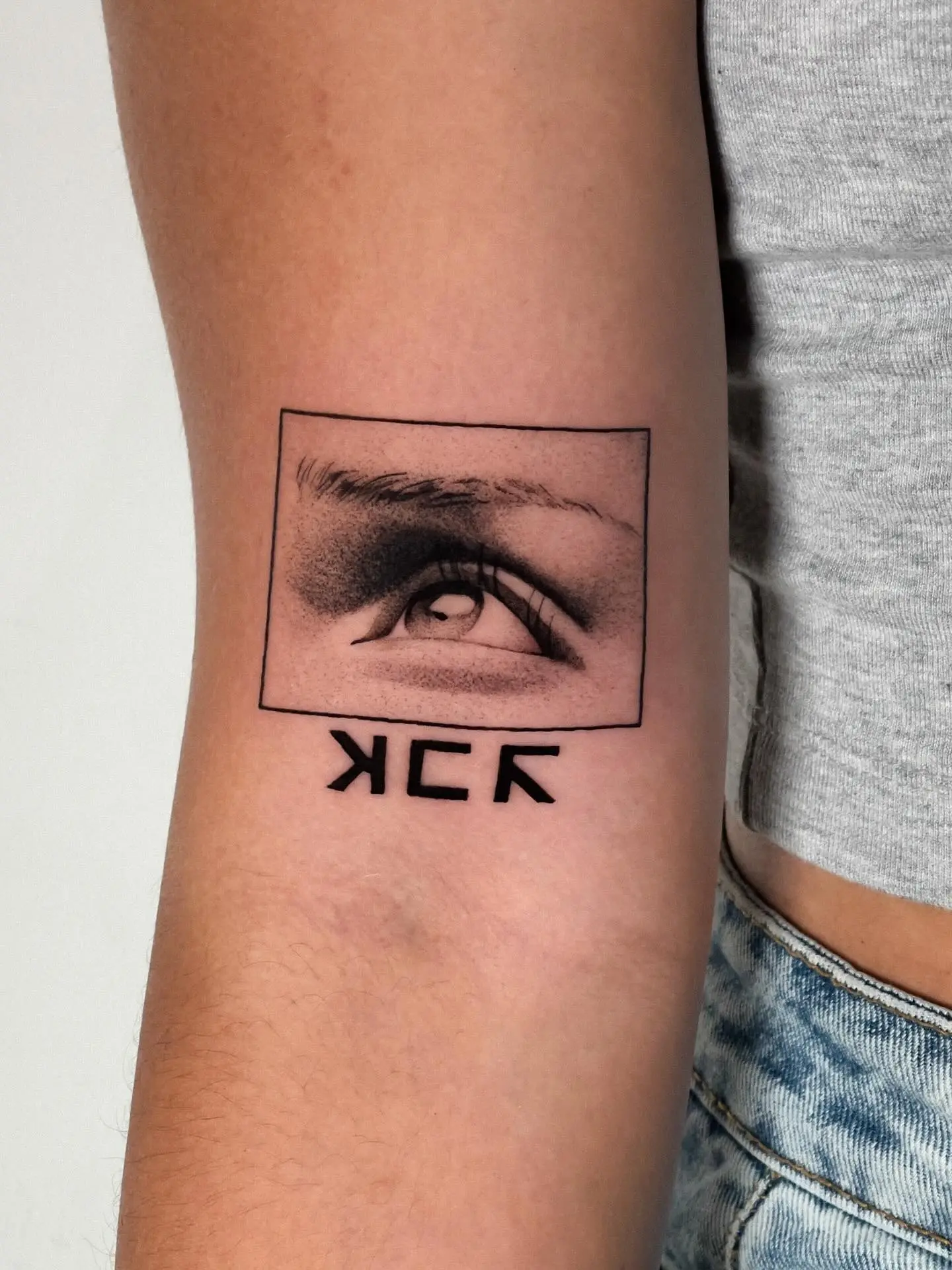 Intriguing eye tattoo blending art styles elegantly