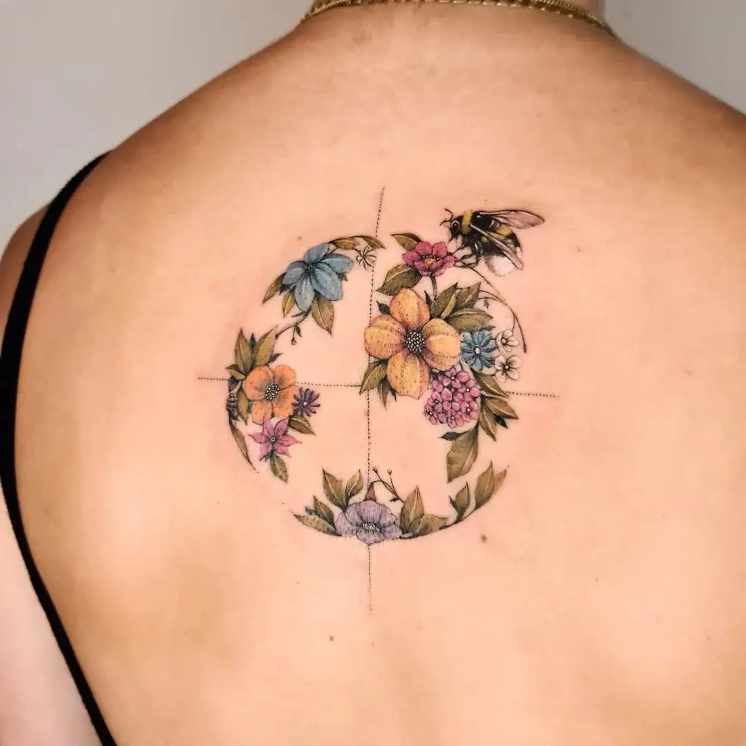 Elegant globe tattoo with floral accents