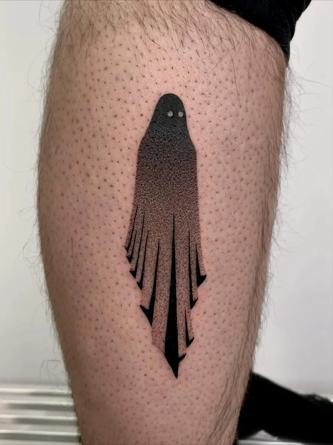 Minimalist ghost silhouette tattoos in dotwork style