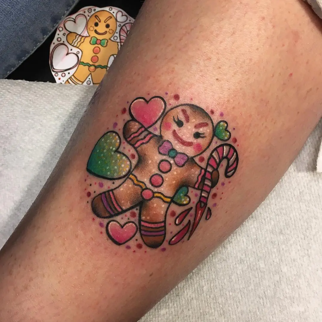 Whimsical gingerbread tattoo with candy cane