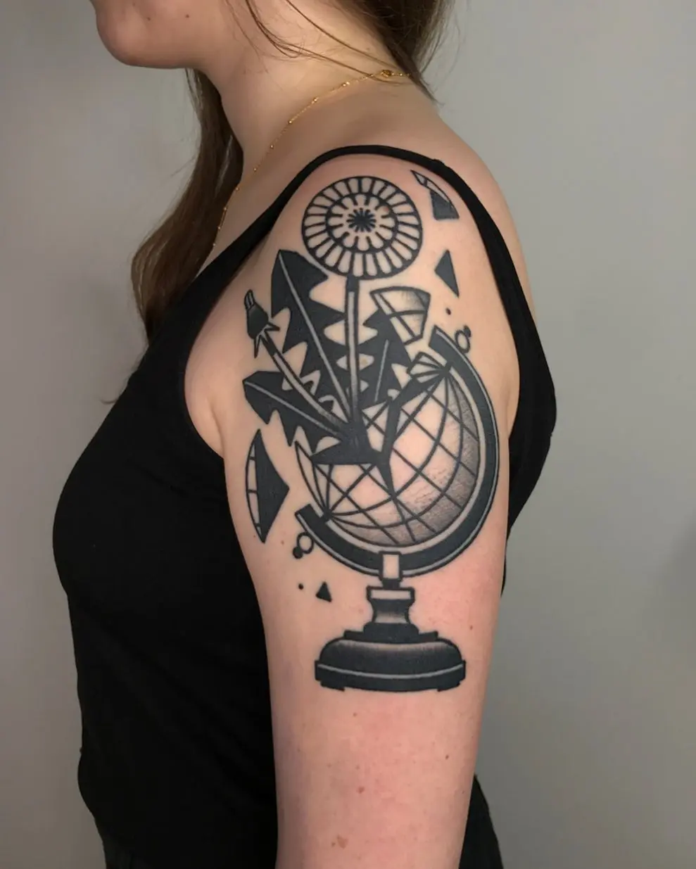 Artistic Globe Tattoo with Geometric Elements
