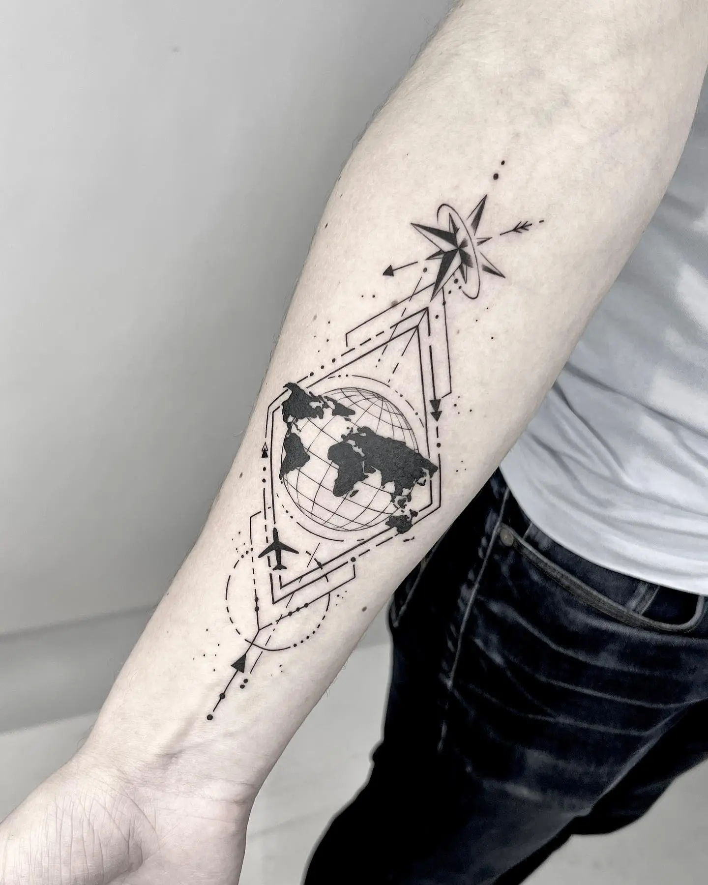 Stylish globe tattoo with modern geometrical elements