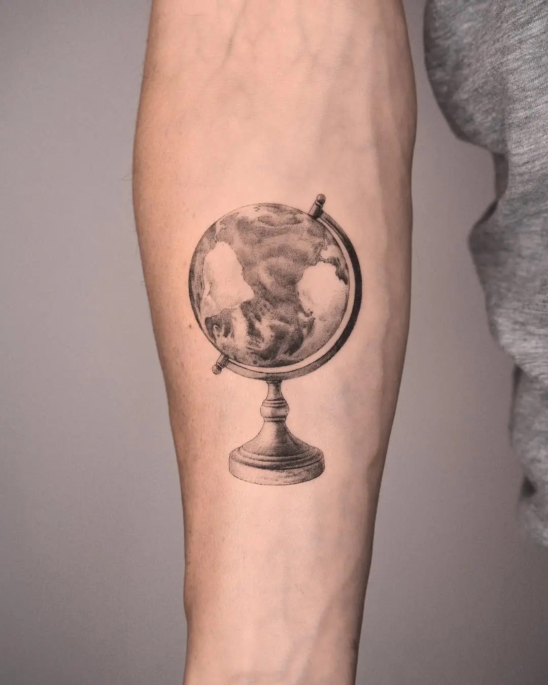 Stunning Globe Tattoo on Forearm