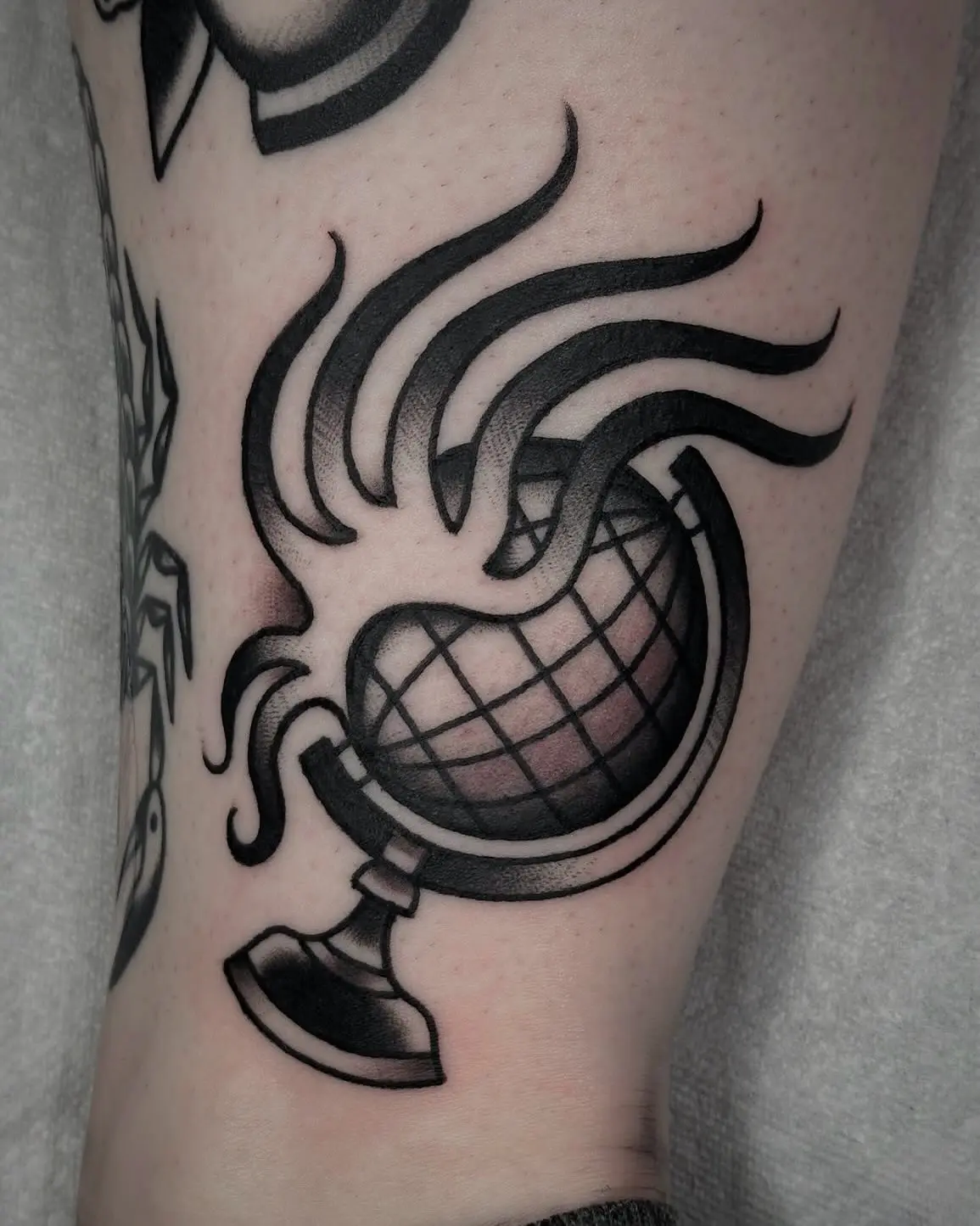Stylish globe tattoo with flaming design