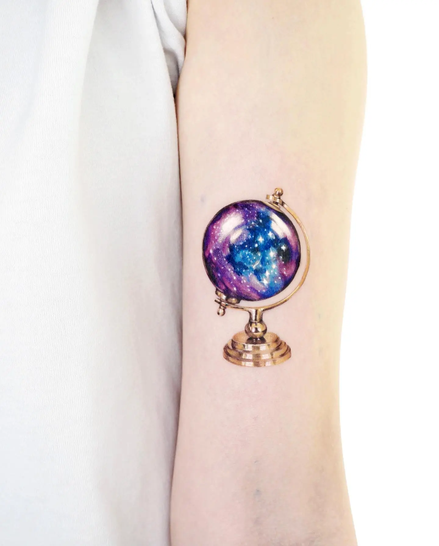 Stunning Cosmic Globe Tattoo for Adventure Lovers