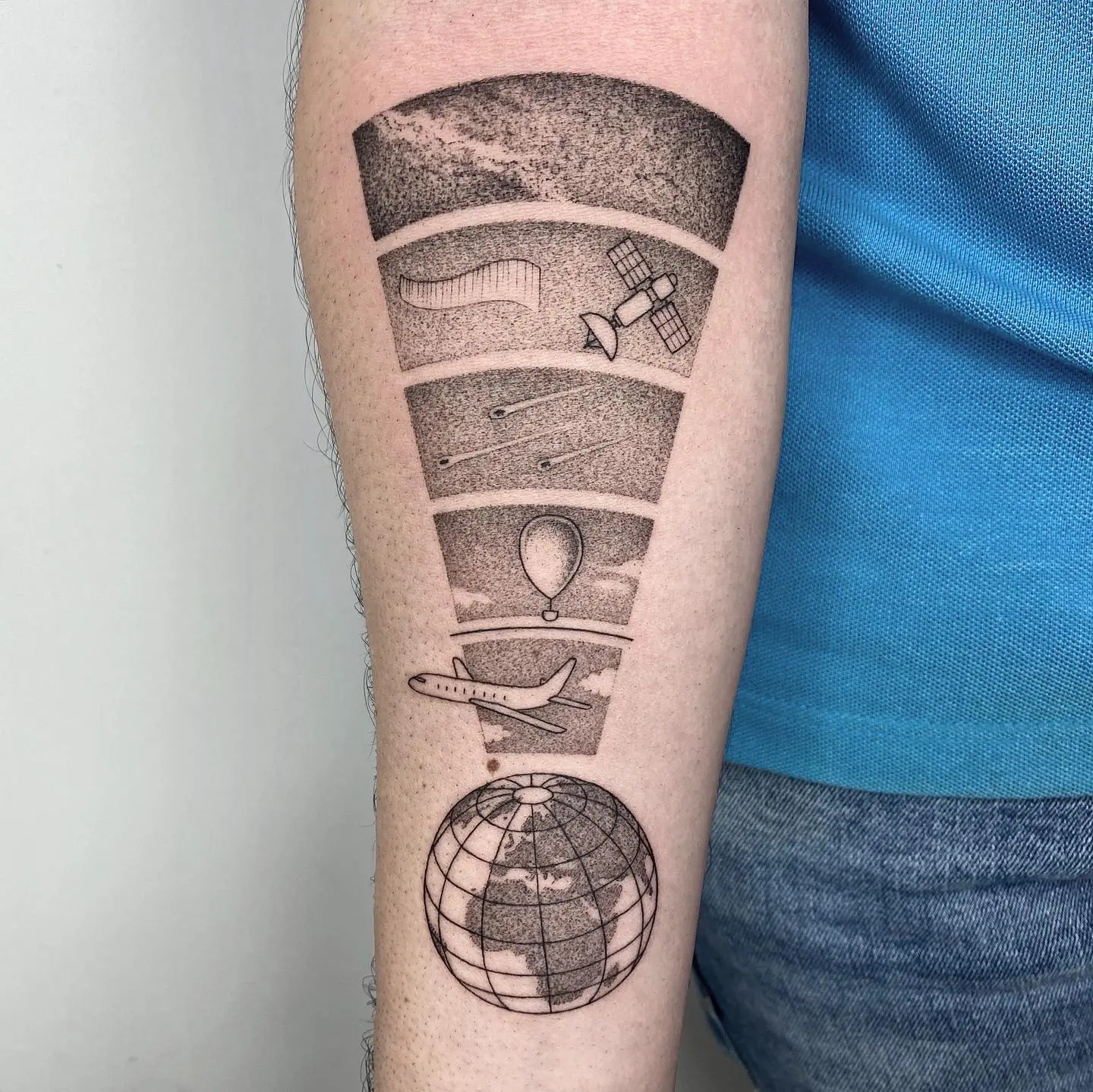 Unique globe tattoo showcasing space exploration themes