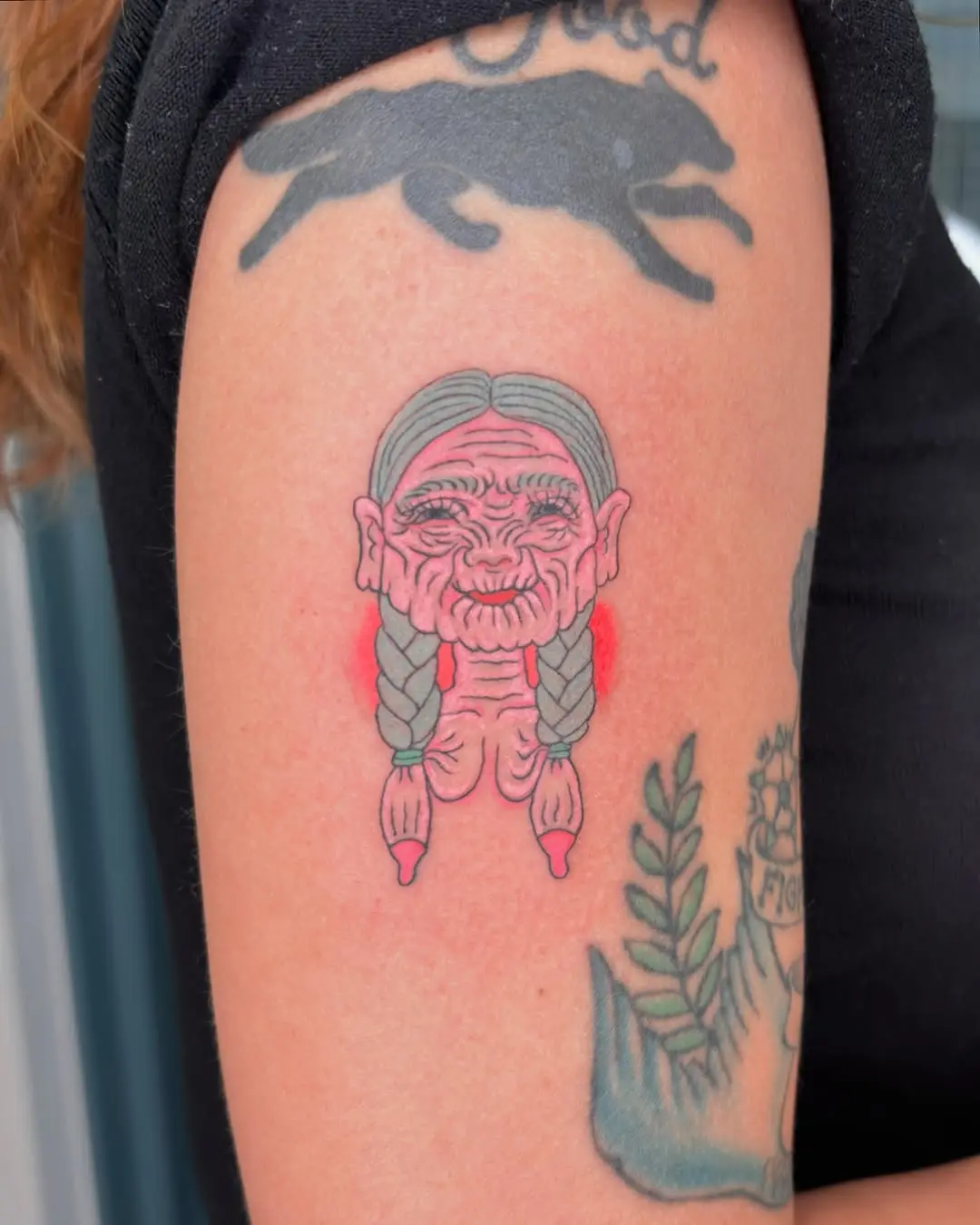 Charming vintage-style grandma tattoo with braids