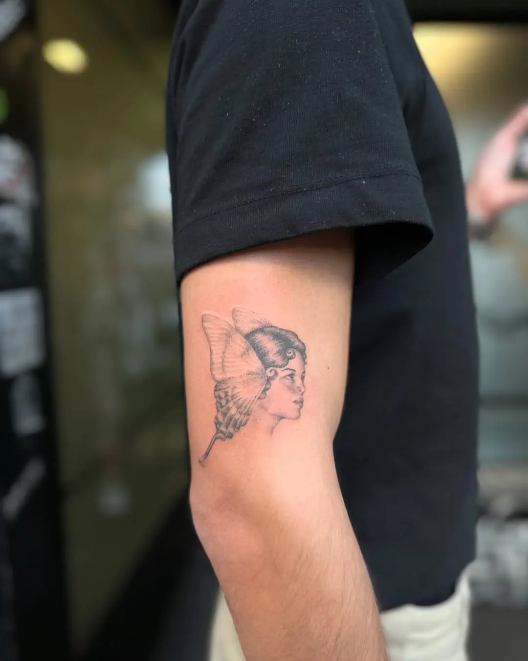 Elegant butterfly lady tattoo on the arm