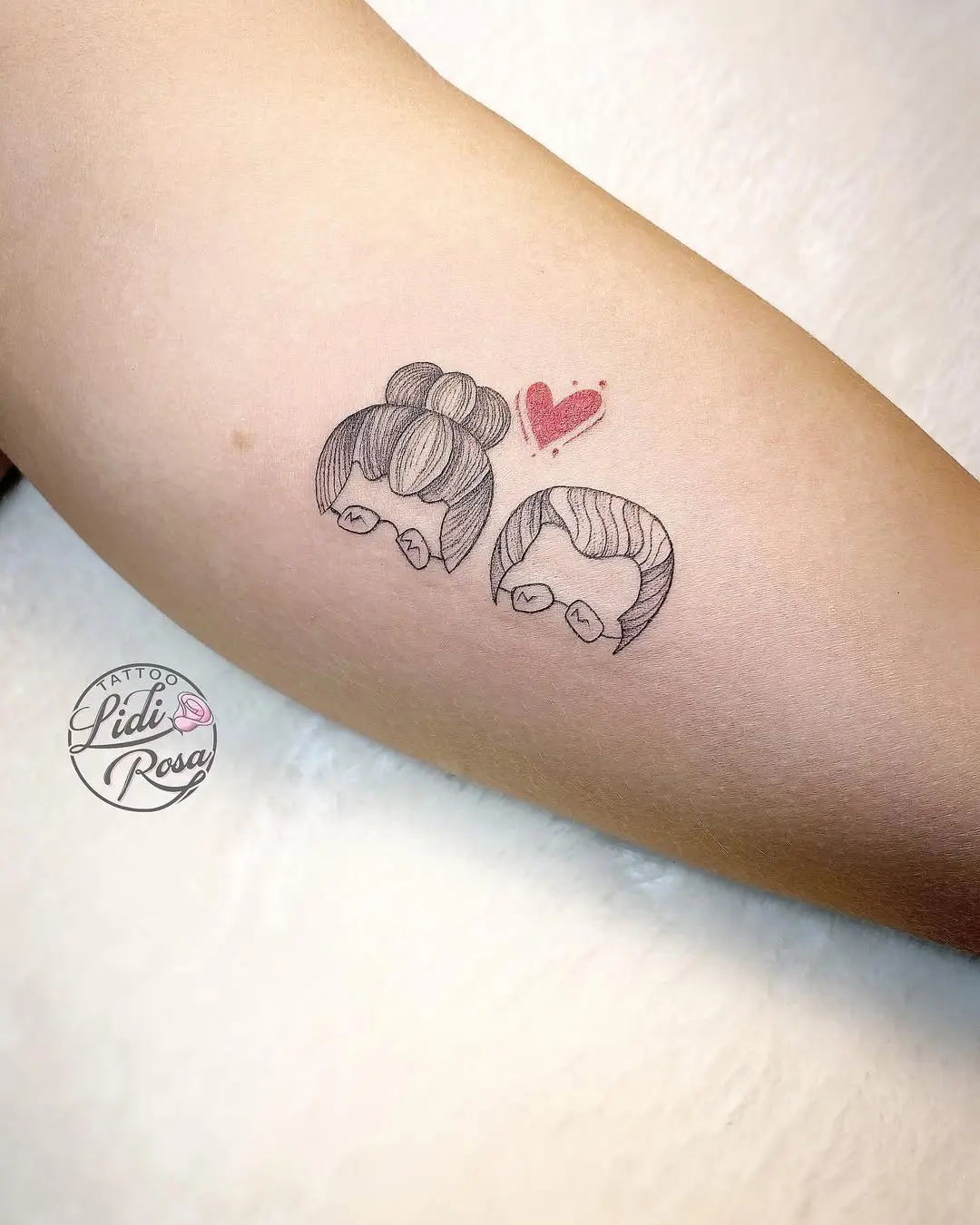 Charming grandma and grandchild tattoo design