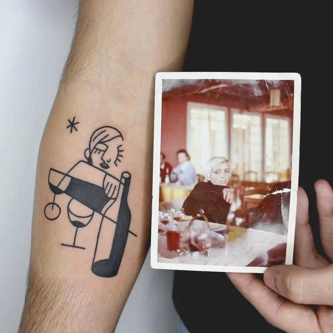 Chic minimalist tattoo featuring a wine theme