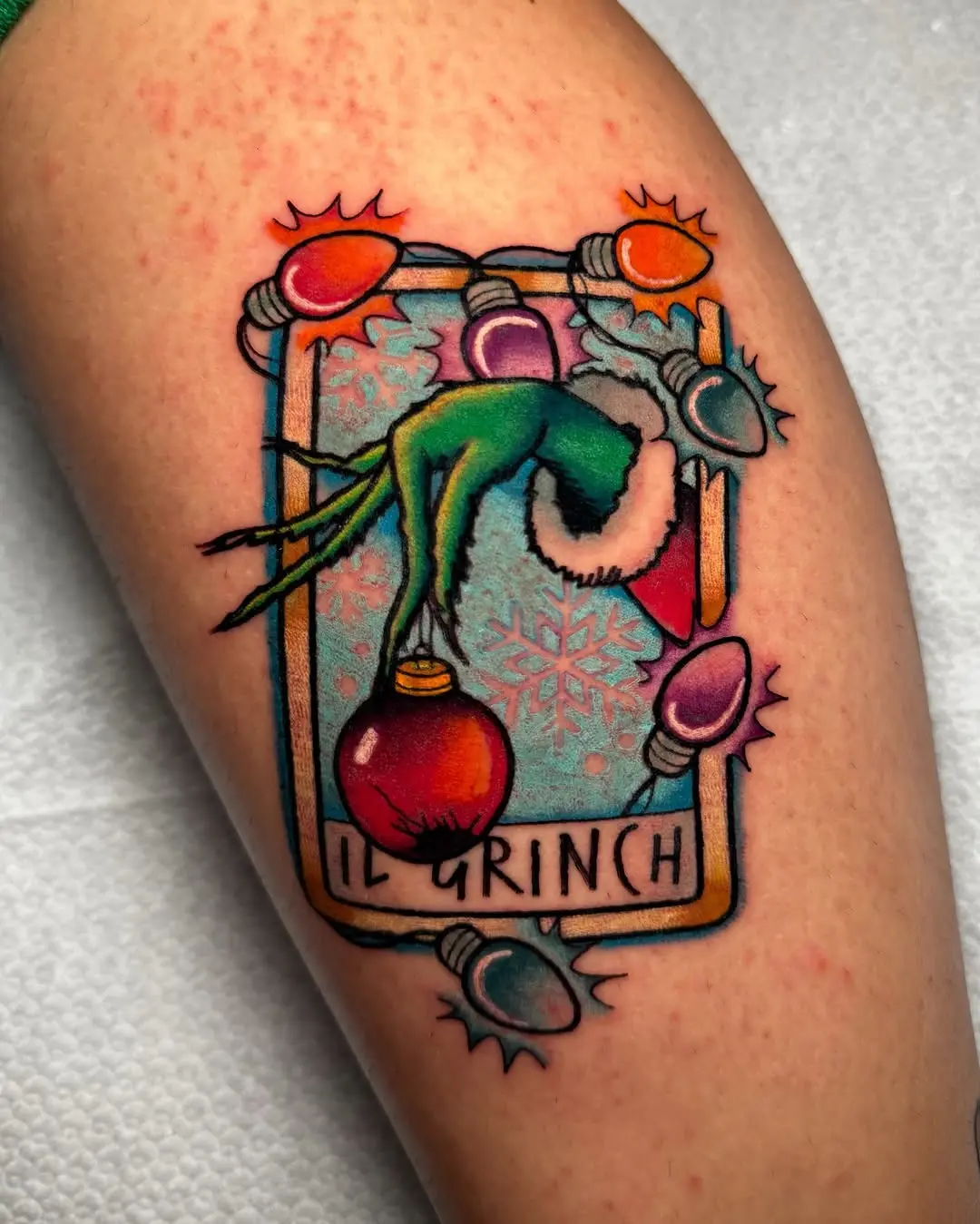 Festive Grinch Tattoo with Holiday Elements