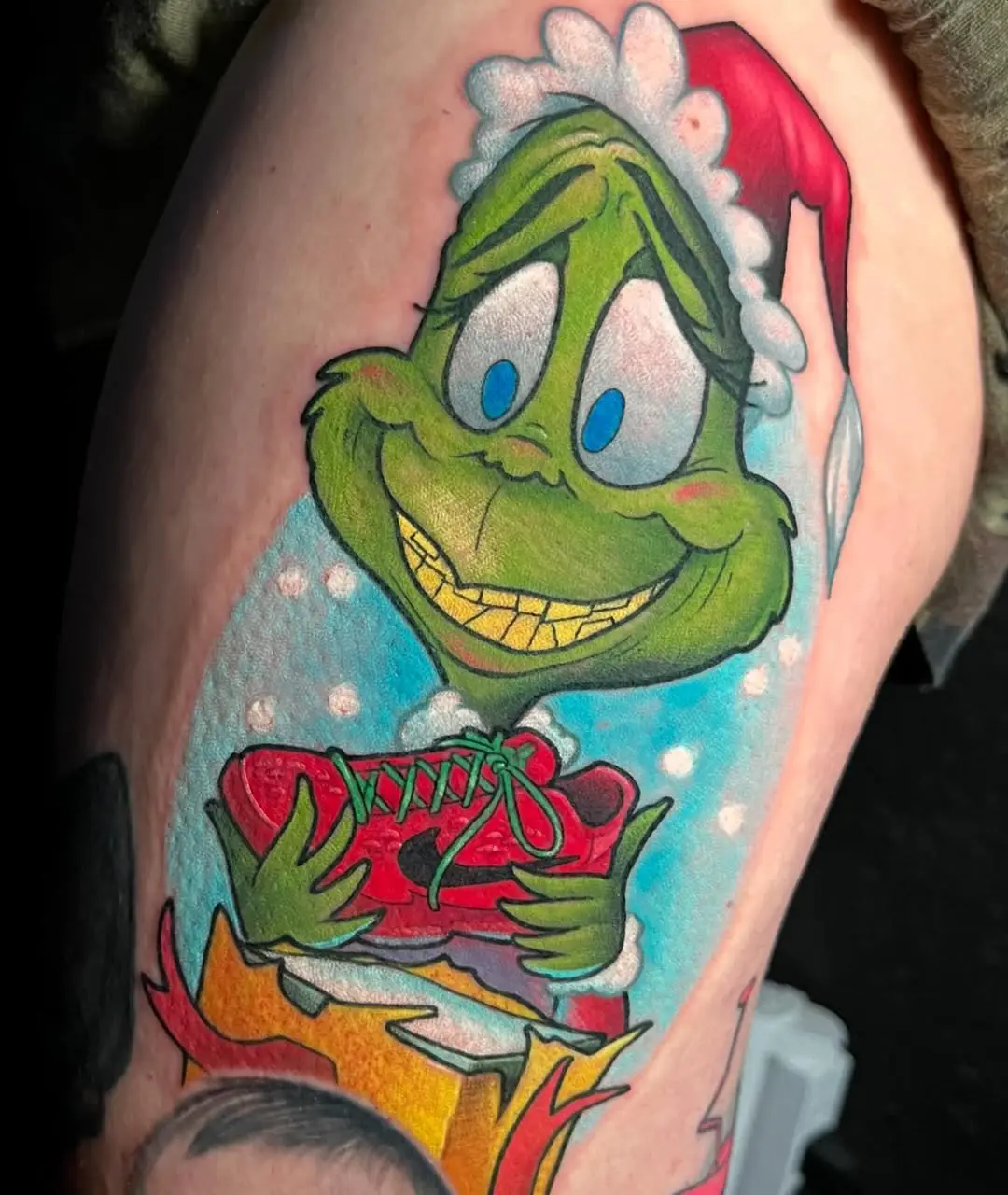 Charming Grinch Tattoo with Holiday Spirit