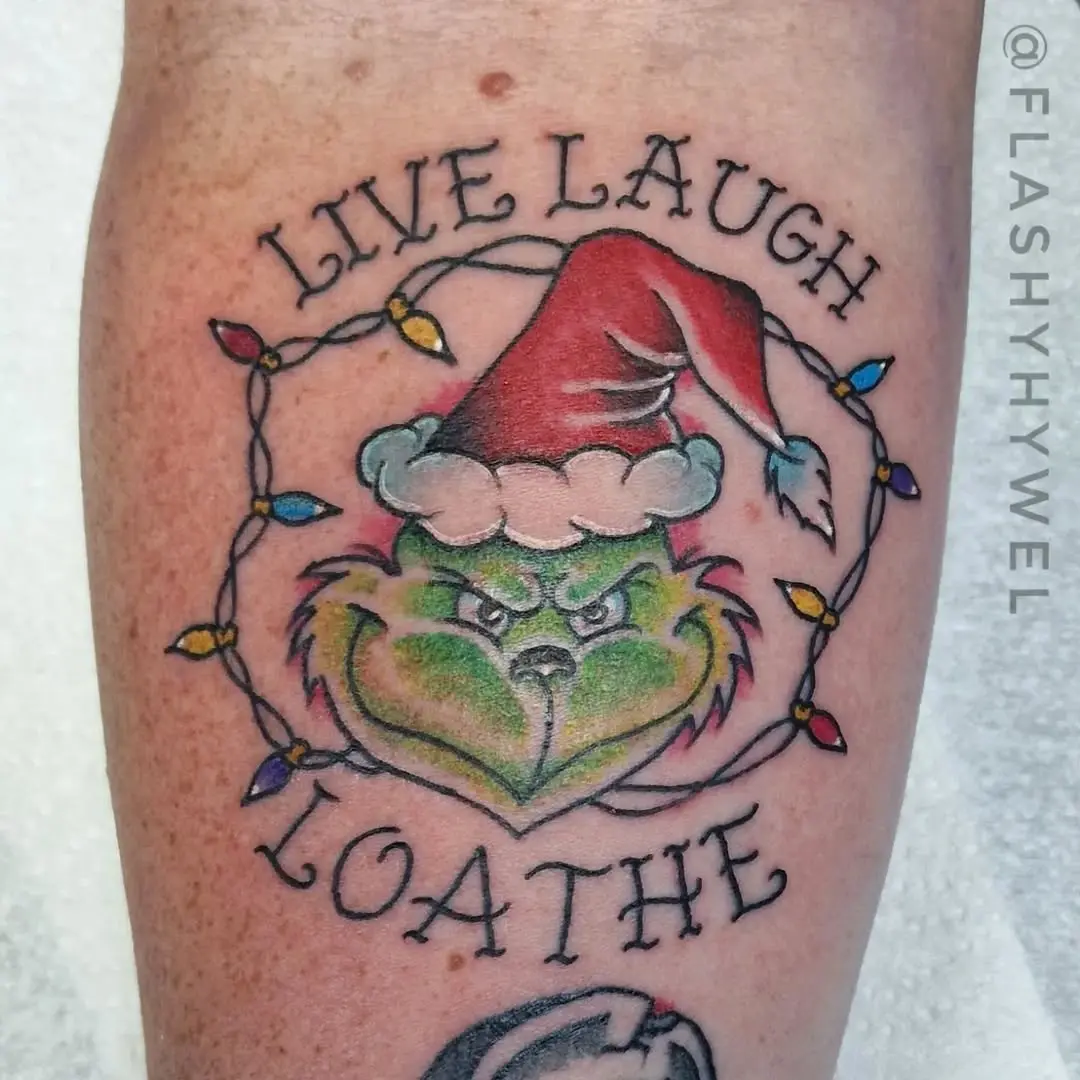 Playful Grinch Tattoo with a Holiday Twist