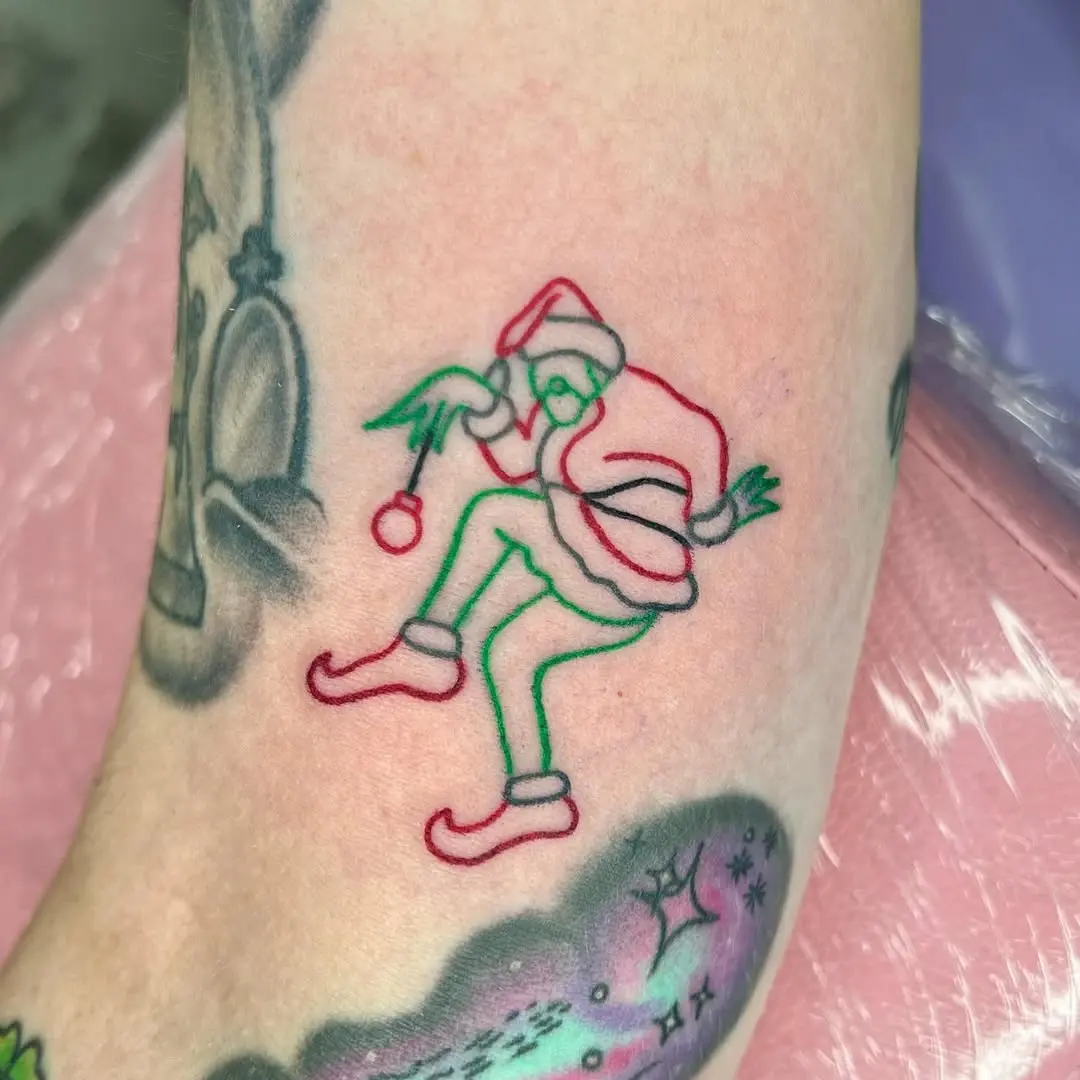 Whimsical Grinch Tattoo for Holiday Cheer
